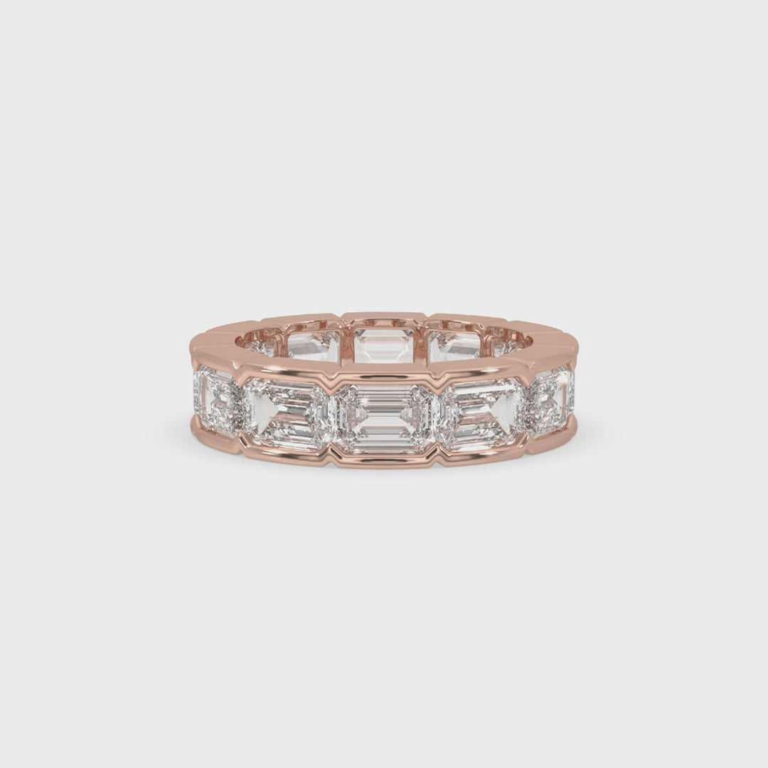 East-West bezel set emerald cut